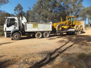 Grader loaded for transport - Wet Hire Sutton NSW